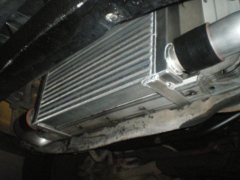 1998 Ford Crown Victoria - Close-up view of an aftermarket intercooler, likely installed on a vehicle for performance enhancement.