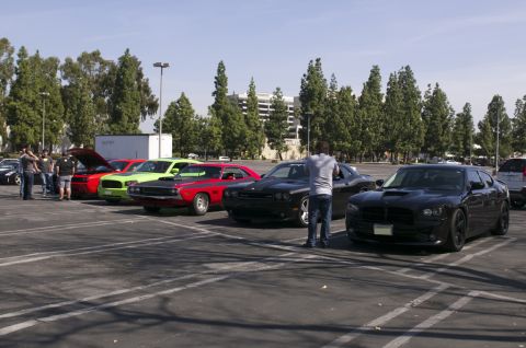 2006 Cadillac STS - A gathering of Dodge muscle cars, including Challengers and Chargers, parked in an outdoor lot.