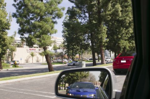 2006 Cadillac STS - A red sedan is visible in the side mirror of the vehicle.