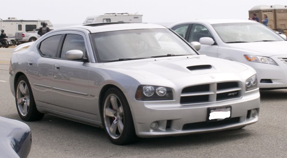 Silver Dodge Charger SRT8 with hood scoop and SRT badge