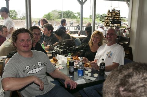 2006 Cadillac STS - Group of people gathered around tables inside a casual dining establishment.