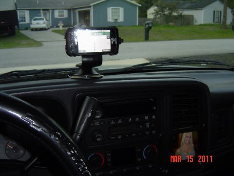 2005 Chevrolet Silverado 1500 - Interior view of a 2005 Chevrolet Silverado 1500, a GPS unit and a personal photo on the dashboard.