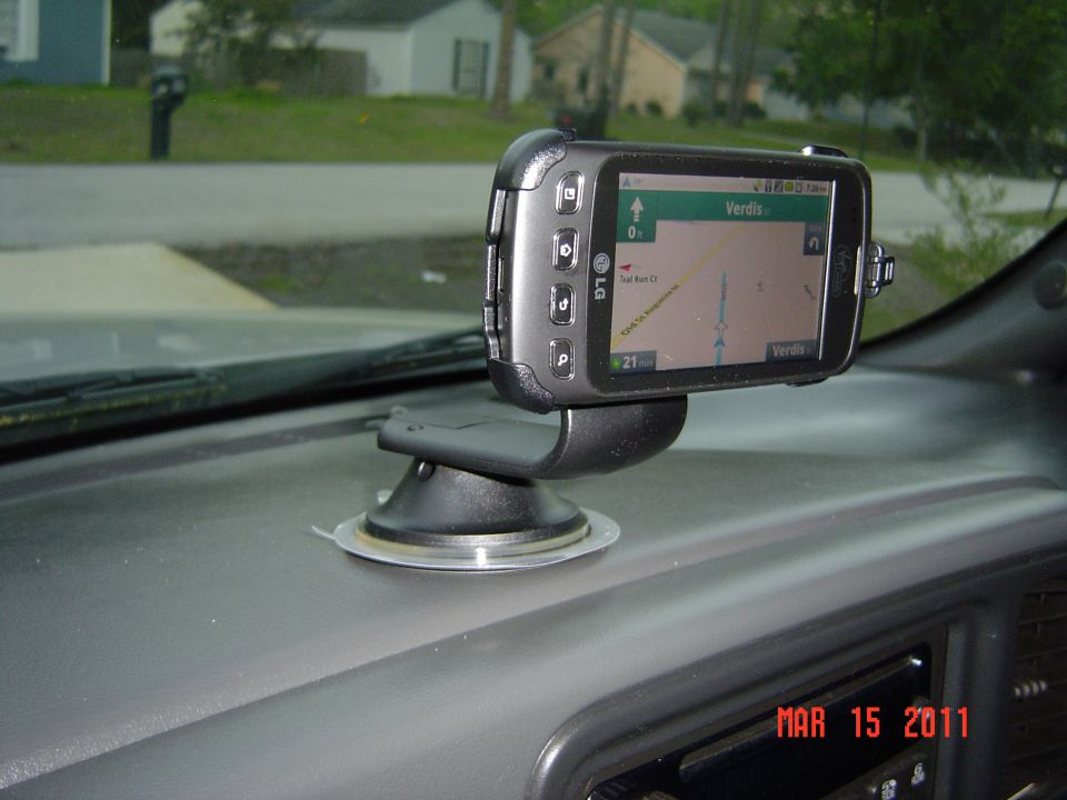 GPS unit on dashboard, showing a map with 'Verdis' on screen. Date stamp says MAR 15 2011