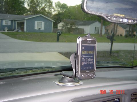 2005 Chevrolet Silverado 1500 - Interior view of a vehicle's dashboard with a cell phone mounted.
