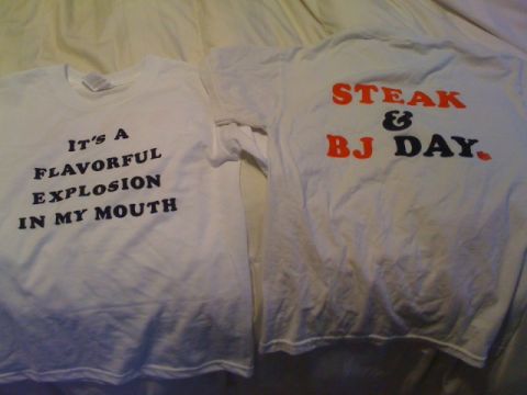1990 Ford Probe - Two t-shirts with humorous text are displayed on a bed.