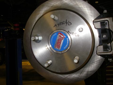 1990 Ford Bronco - Close-up of a brake rotor a Currie hub with handwritten notes and part numbers.