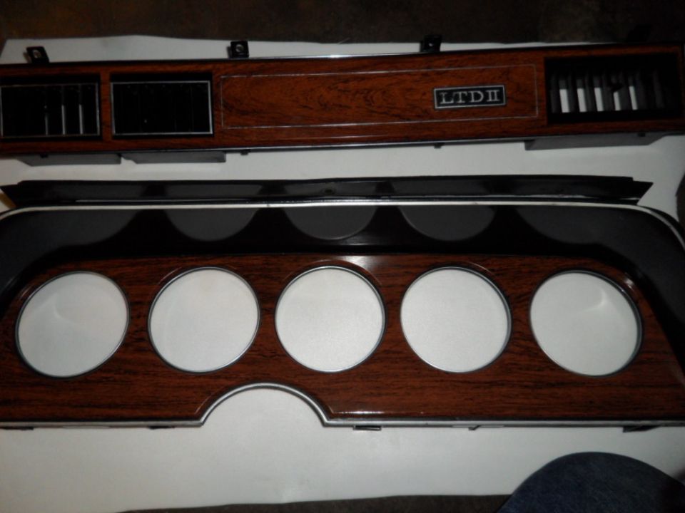 Dashboard trim with wood grain and LTD II badge