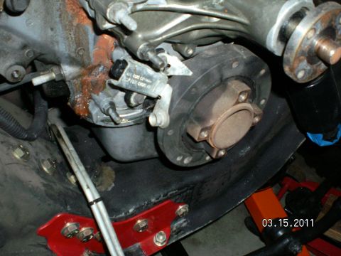 1996 Ford Bronco - Close-up of an engine component, possibly a timing pointer, showing signs of repair or maintenance.