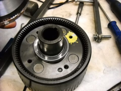 1993 Ford C-150 (Centurion Conversions) - A planetary gear set, likely from a transmission, is shown with various tools nearby, suggesting a repair or rebuild process.