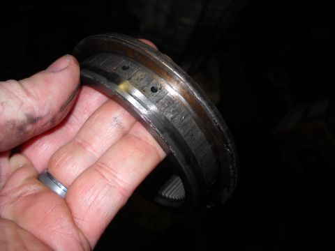 1993 Ford C-150 (Centurion Conversions) - Close-up of a damaged transmission bearing, likely from an E4OD rebuild.
