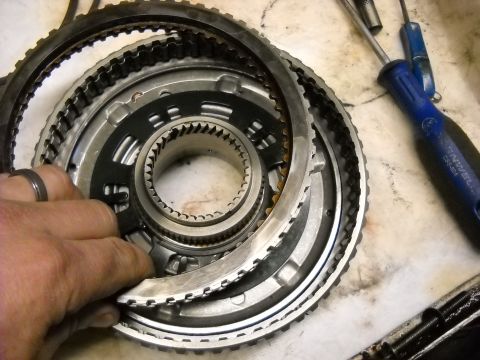 1993 Ford C-150 (Centurion Conversions) - Close-up of transmission clutch pack and input shaft components during a rebuild.
