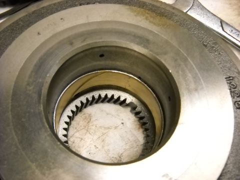 1993 Ford C-150 (Centurion Conversions) - A close-up view of a mechanical part, likely from a vehicle's transmission, revealing intricate gear teeth.