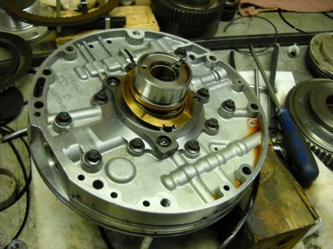 1993 Ford C-150 (Centurion Conversions) - Close-up of a transmission oil pump assembly, showing the Ford logo and Lester-28 casting number.