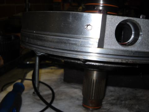 1993 Ford C-150 (Centurion Conversions) - Close-up of a metal transmission component with splines and an orange seal.