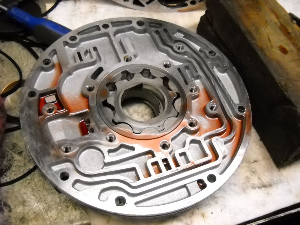 Close-up of an automatic transmission pump housing with oil channels