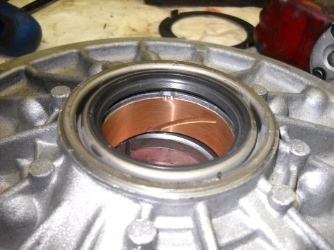 1993 Ford C-150 (Centurion Conversions) - A transmission pump housing is shown with internal components, likely during a rebuild.