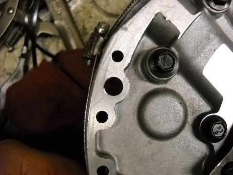 1993 Ford C-150 (Centurion Conversions) - A close-up view of a metal transmission component, likely during a rebuild or repair process.