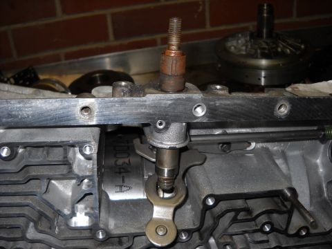 1993 Ford C-150 (Centurion Conversions) - Close-up of a transmission component, possibly for an E4OD rebuild, with visible part identification.