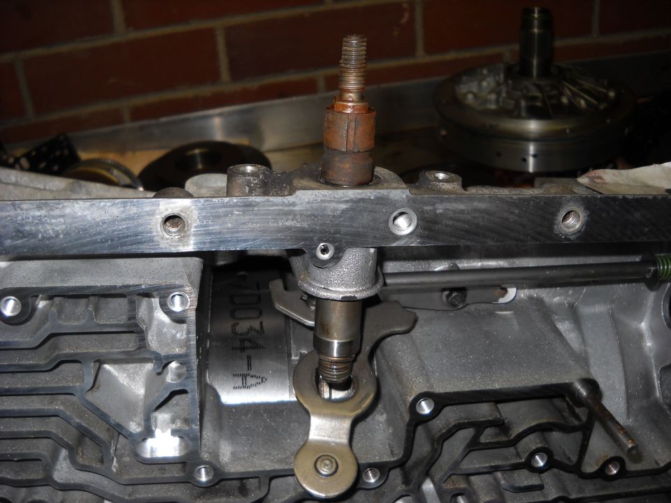 Manual shift shaft and park rod lever inside an open automatic transmission case