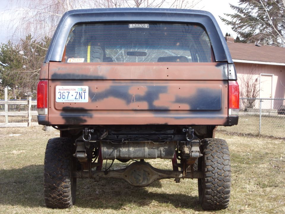 1988 Ford Bronco rear view with camouflage paint and Washington license plate