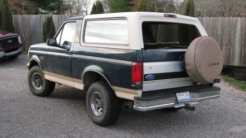 1992 Ford Bronco - This 1992 Ford Bronco is seen from the rear, a two-tone paint scheme and a spare tire cover.