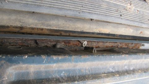 1992 Ford Bronco - In between the tailgate and body, or bottom of the tailgate