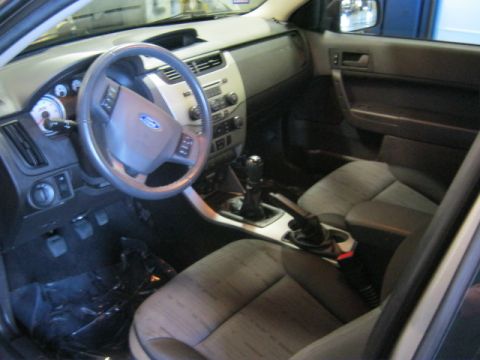 1976 Ford Ranchero - Interior view of a car, showing the steering wheel, dashboard, and seats.