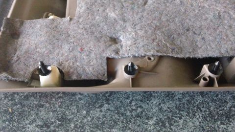 1994 Ford Bronco - Close-up of the interior trim panel and fasteners on a 1994 Ford Bronco.