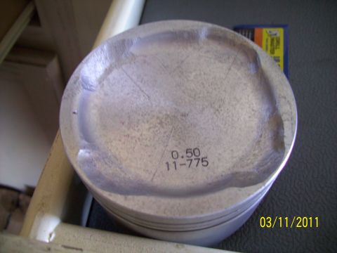 1995 Ford Probe - A single piston, marked with "0.50 11-775", is shown with visible wear.