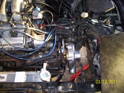1995 Ford Probe - Engine bay modification with a turbocharger and custom plumbing visible.