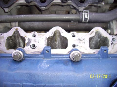 1995 Ford Probe - Close-up of an engine's intake manifold, showing bolts and gasket detail. Date stamp indicates 03/17/2011.
