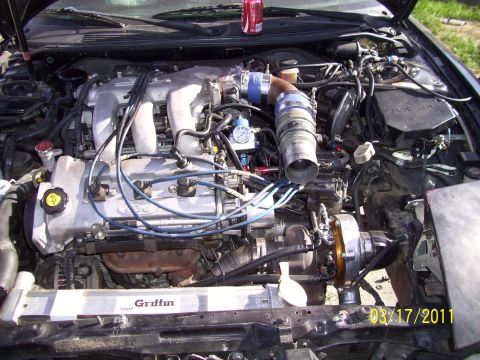1995 Ford Probe - Engine bay modifications including a turbocharger and custom intake piping are visible.
