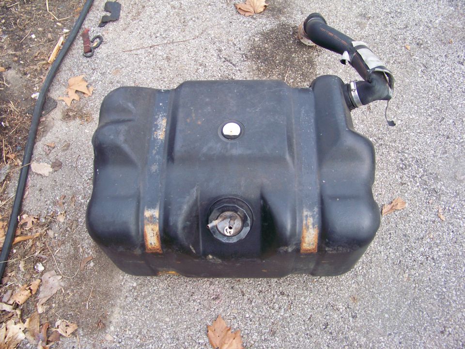black plastic fuel tank with filler neck attached