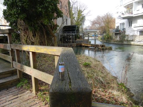 1999 Lincoln Town Car - Canal scene with a water wheel and bridge in the foreground.
