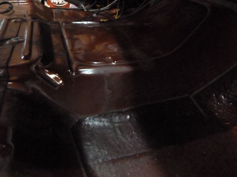 1993 Ford C-150 (Centurion Conversions) - The interior floor pan of a vehicle, showing its structure and some wiring.