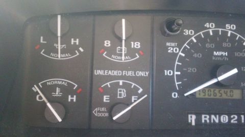1994 Ford Bronco - Close-up of a Ford instrument cluster showing oil pressure, voltmeter, coolant temperature and fuel gauges beside an MPH/km-h speedometer w…