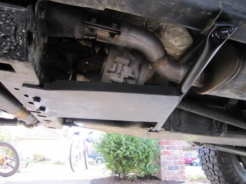 2008 Jeep Wrangler - The underside of a vehicle, showing the skid plate and exhaust system.