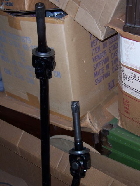 1992 Ford Bronco - Driveshafts with universal joints are stored in boxes.