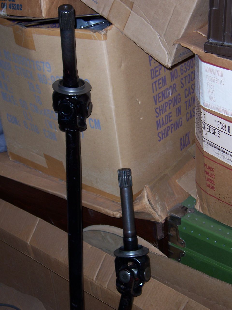 Two driveshafts with universal joints in storage