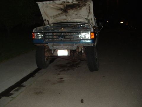 1989 Ford Bronco - This truck appears to be a Ford F-Series, possibly from the late 1980s, with its hood up.
