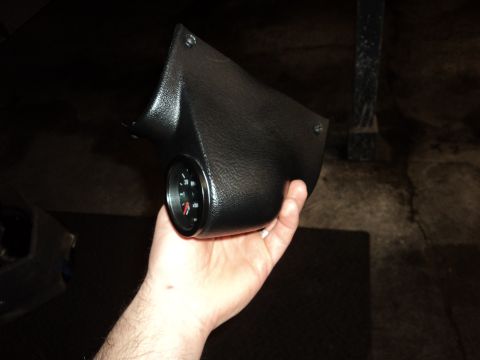 2004 Mercury Grand Marquis - A black gauge pod with a gauge is held in a hand, with a watermark for Supermotors.net visible.