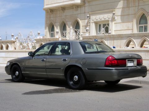 2001 Mercury Grand Marquis - Grey 2001 Mercury Grand Marquis sedan parked in front of an ornate building.