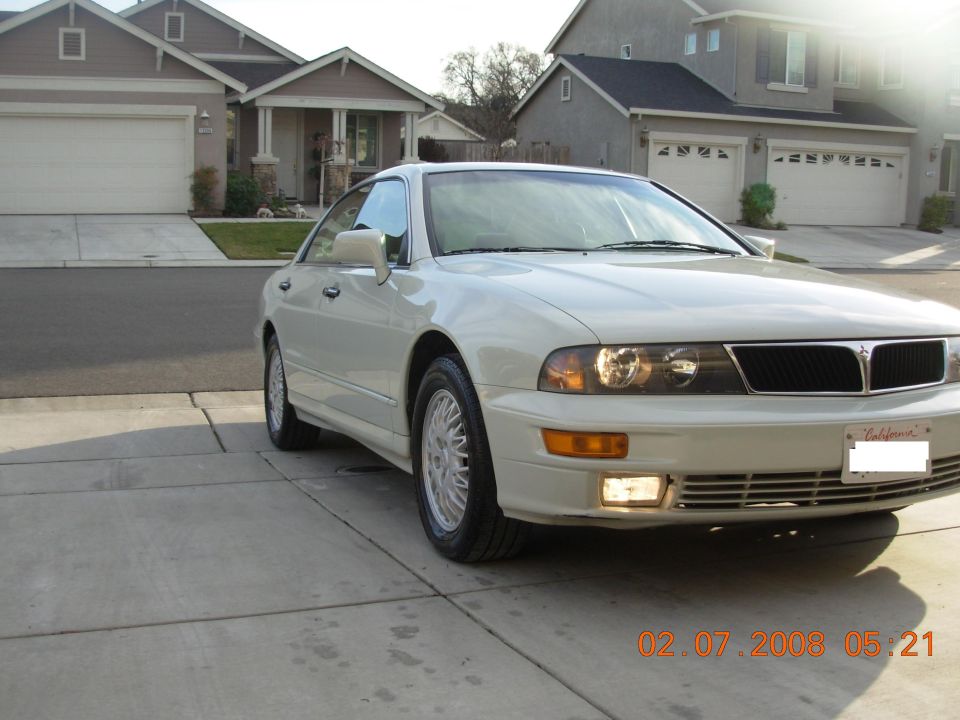 1999 Mitsubishi Diamante parked in front of a suburban house