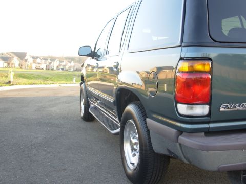 1997 Ford Explorer - Rear view of a 1997 Ford Explorer SUV, showing the taillight and "EXPLORER" badging.