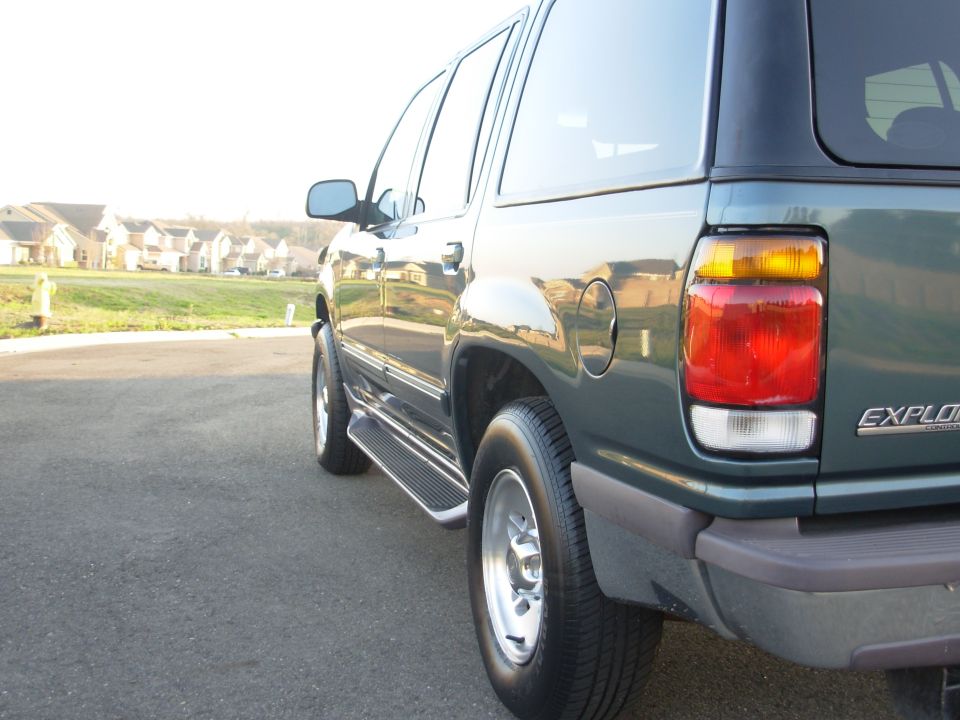 1997 Ford Explorer rear quarter panel and taillight, dark green paint