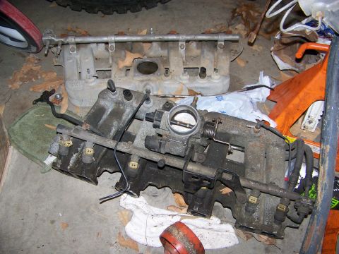1992 Jeep YJ - Engine intake manifold assembly, likely for a Jeep YJ, shown with fuel injectors and throttle body.