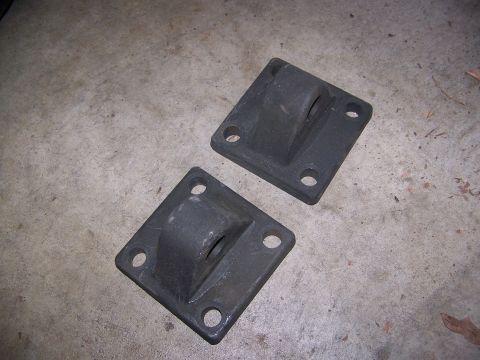 1992 Jeep YJ - A pair of black metal brackets are shown on a concrete surface.
