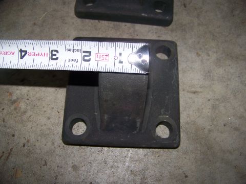 1992 Jeep YJ - A black metal part is shown with a tape measure indicating its dimensions.