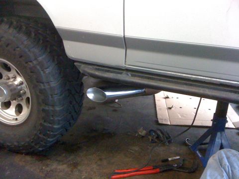 1996 Ford C-350 (Centurion Conversions) - Side view of a 1996 Ford C-350 (Centurion Conversions) with a prominent straight pipe exhaust.