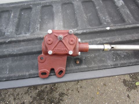 1979 Ford Bronco - A red steering gearbox, identified by the visible part number 7125999, is shown resting on a truck bed.